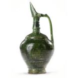 A UMAYYAD GREEN GLAZED POTTERY JUG, EASTERN MEDITERRANEAN, 8TH-9TH CENTURY