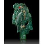 A MUGHAL CARVED EMERALD DEPICTING A PARROT IN A TREE, 19TH CENTURY