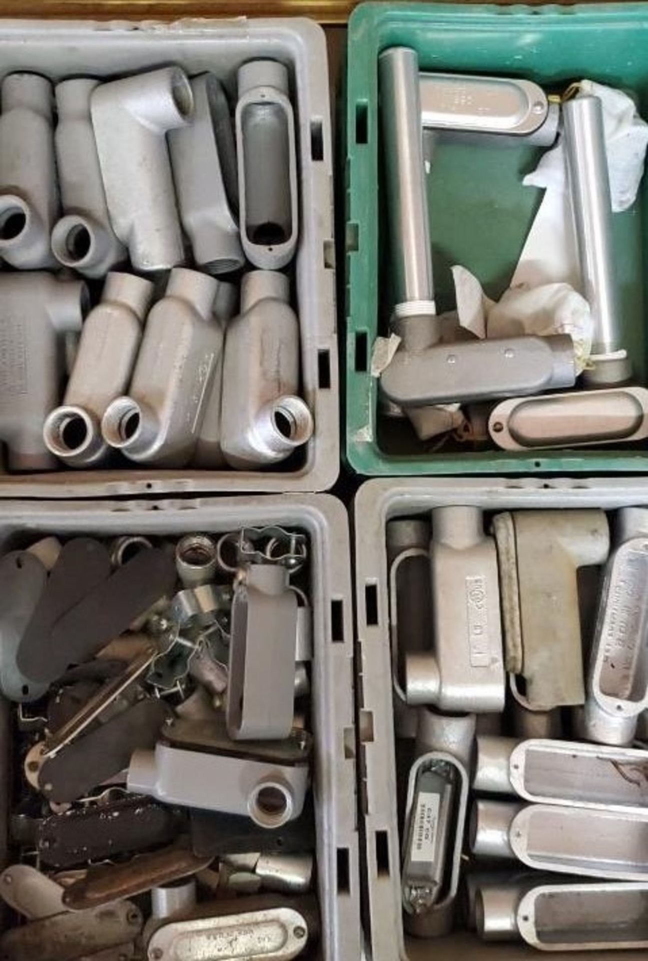 (4) Trays of Conduit Bodies, Clamps, & Covers