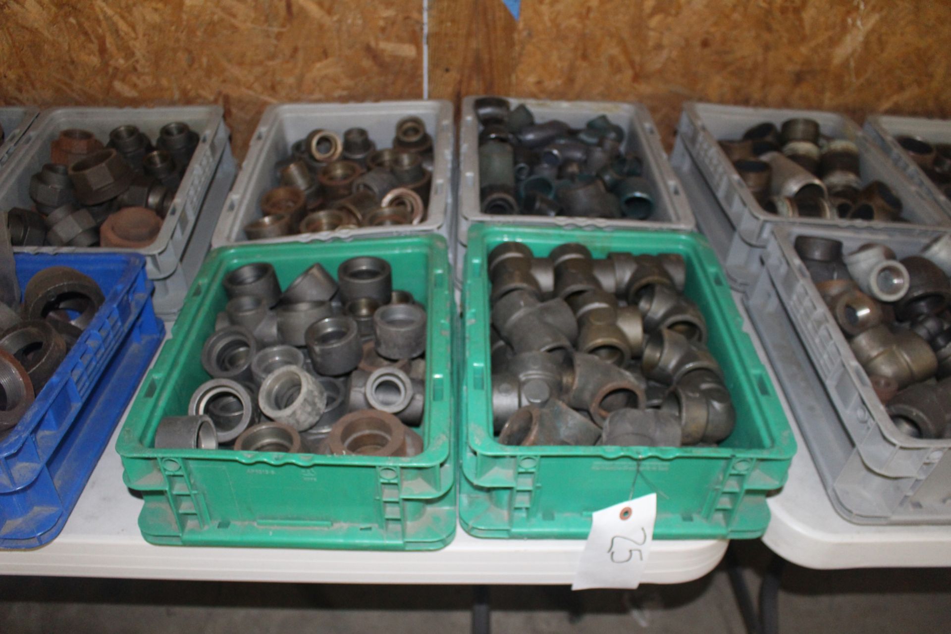 Four Bins of Steel Pipe Fittings