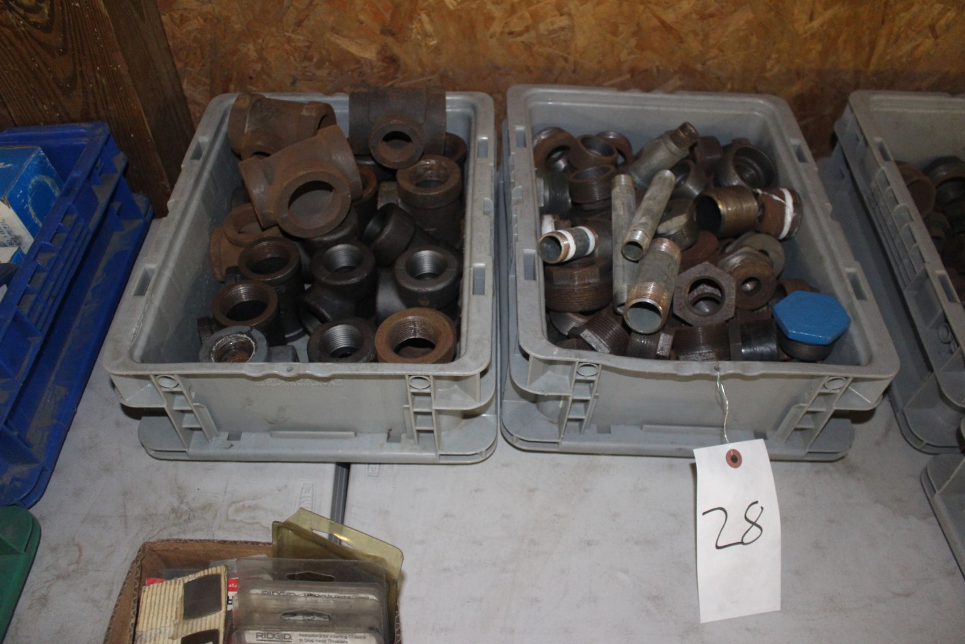 Two Bins of Steel Pipe Fittings