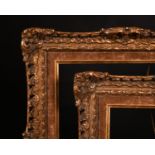 20th Century English school. A Gilt Composition frame with swept and pierced centres and corners