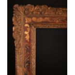 19th Century English School. A Gilt Composition and Painted Frame with swept corners, rebate 25" x