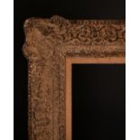 20th Century English School. A Gilt Composition Frame with swept centres and corners, with a