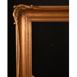 20th Century English School. A Gilt Composition Frame with swept corners, rebate 23" x 18" (58.4 x