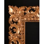 19th Century Italian School. A Carved Giltwood Florentine Frame, rebate 27” x 21.5” (68.5 x 54.7cm)