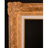 20th Century English School. A Gilt Composition Frame with swept centres and corners and a fabric