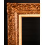 19th Century French School. A Gilt Composition Frame, with Swept Centres and Corners, with a White