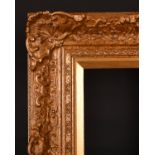 20th Century English School. A Gilt Composition Frame with swept centres and corners, rebate 16" x