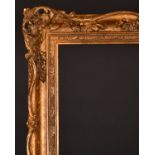 20th Century English School. A Gilt Composition Frame with swept and pierced centres and corners,