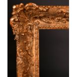20th Century English School. A Gilt Composition Frame with swept centres and corners, rebate 18" x