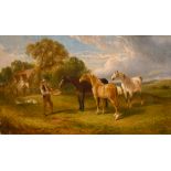 Edwin Long Meadows (act.1854-1905) British. A Figure feeding the Horses, Oil on Canvas, Signed and
