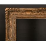 18th Century French School. A Carved Giltwood Louis Frame, with swept centres and corners, (re-