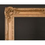 20th Century English School. A Gilt Composition Frame, with swept and pierced centres and corners,