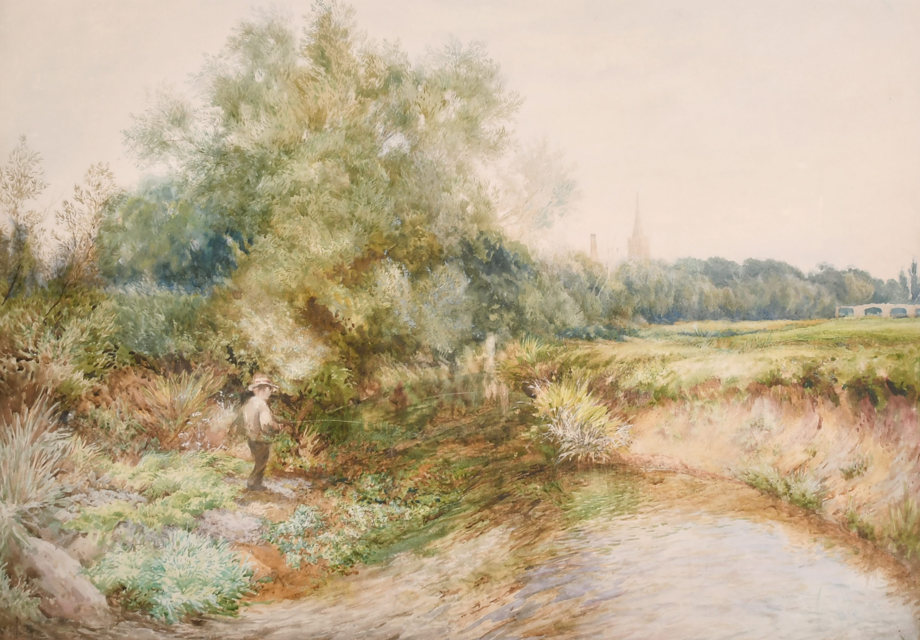 William John Caparne (1856-1940) British. A Tranquil River Landscape with a Boy Fishing and Church