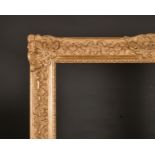 20th Century French School. A Gilt Composition Louis Style Frame, with swept centres and corners,