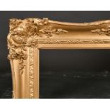 19th Century English School. A Gilt Composition Frame, with swept centres and corners, rebate 36”