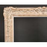 20th Century English School. A Gilt Composition Frame, with swept centres and corners and a white