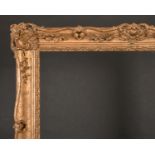 20th Century English School. A Gilt Composition Frame, with swept and pierced centres and corners,