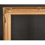 20th Century English School. A Gilt Composition Frame, with swept centres and corners, rebate 30”