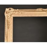 20th Century English School. A Gilt Composition Frame, with swept and pierced centres and corners,