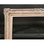 20th Century English School. A Painted Composition Frame, with swept and pierced centres and corners