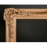 20th Century English School. A Gilt Composition Frame, with swept and pierced centres and corners,