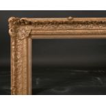 20th Century English School. A Gilt Composition Frame, with swept centres and corners, rebate 37”