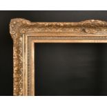20th Century English School. A Gilt Composition Frame, with swept centres and corners, rebate 26.