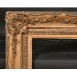 19th Century English School. A Gilt Composition Frame, with swept centres and corners, rebate 30”