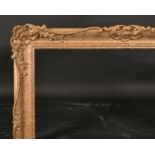 20th Century English School. A Gilt Composition Frame, with swept and pierced centres and corners,