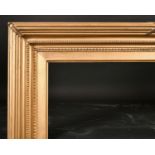 19th Century English School. A Double Hollowed Gilt Frame, with outer ribbing and ribbons, rebate