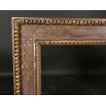 19th Century English School. A Carved Giltwood and Painted Frame, rebate 45” x 35.5” (114.2 x 90cm)