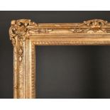 20th Century European School. A Gilt Composition Frame, with swept and pierced centres and