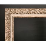 20th Century English School. A Gilt and Painted Composition Frame, with Swept Centres and Corners,