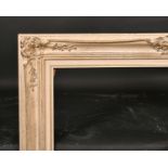 20th Century English School. A Painted Composition Frame, with swept centres and corners, rebate 36”