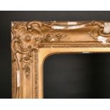 19th Century English School. A Gilt Composition Frame, with swept centres and corners, arched,