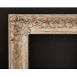 20th Century English School. A Gilt and Painted Composition Frame, with swept centres and corners,