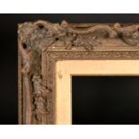 20th Century English School. A Gilt Composition Frame, with swept and pierced centres and corners,