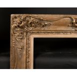 19th Century English School. A Gilt and Painted Composition Frame, with swept centres and corners,