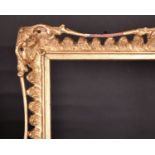 20th Century English School. A Gilt Composition Frame, with swept and pierced centres and corners,