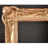 20th Century English School. A Gilt Composition Frame, with swept and pierced centres and corners,