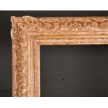 Early 20th Century French School. A Carved Giltwood and Painted Frame, with swept centres and