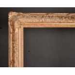 20th Century English School. A Gilt Composition Frame, with swept centres and corners, rebate 31.