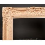 20th Century French School. A Partially Carved Giltwood Frame, with swept and pierced centres and