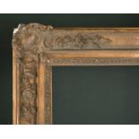19th Century European School. A Gilt Composition Frame, with swept corners, rebate 65" x 53" (165.