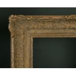 20th Century English School. A Gilt Composition Louis Style Frame, with swept centres and corners,