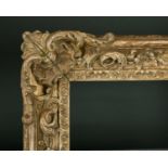 20th Century French School. A Louis Style Carved Giltwood Frame, with swept and pierced corners,