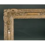 20th Century French School. A Louis Style Carved Giltwood Frame, with swept and pierced centres