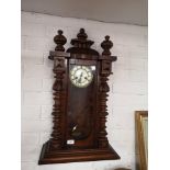 Large victorian wall clock with pendulum.